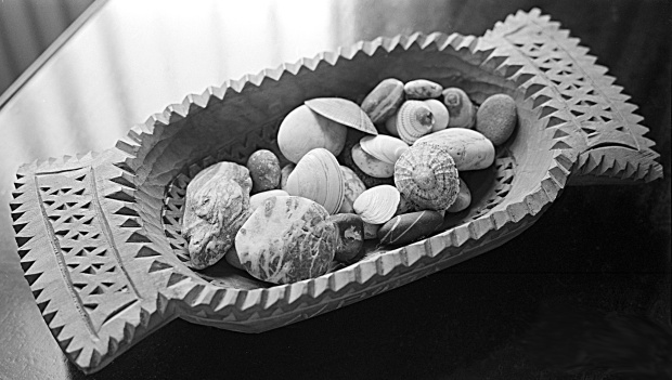 Wooden dish by Nicolae Popa, of Neamt 'county', Romania, with pebbles and shells. 